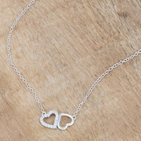 Sweet and Romantic Rhodium Melded CZ Hearts Necklace